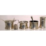 A hallmarked silver salt, mustard, pepper, thimble and napkin ring, various hallmarks (5).