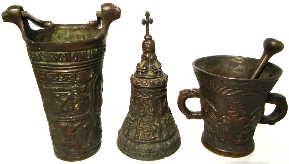 Three various pieces of Belgian bronzeware; a pestle and mortar, a miniature bucket and a bell,