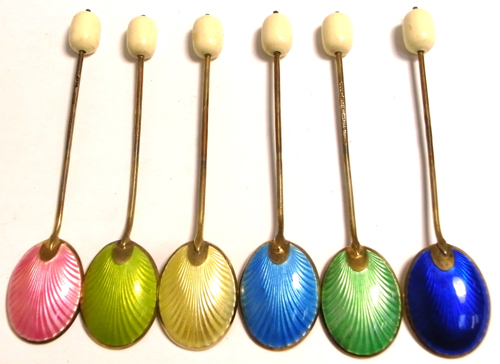 A cased set of six George VI hallmarked silver and enamel coffee bean finial teaspoons,