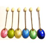 A cased set of six George VI hallmarked silver and enamel coffee bean finial teaspoons,