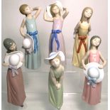 A set of six Lladro figurines all depicting ladies with hats in various poses, all approx 25cm high,