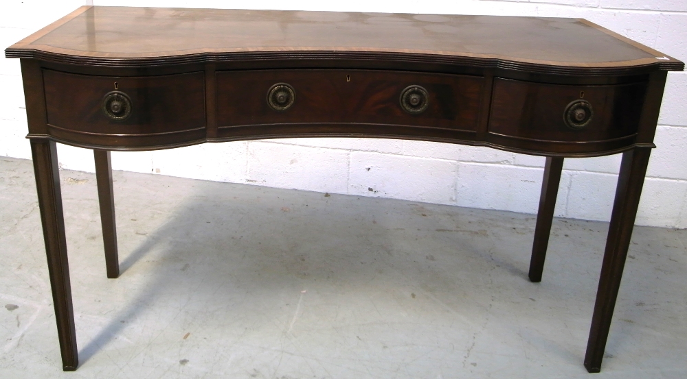 A reproduction mahogany and inlaid serpentine front sideboard with three drawers to square section