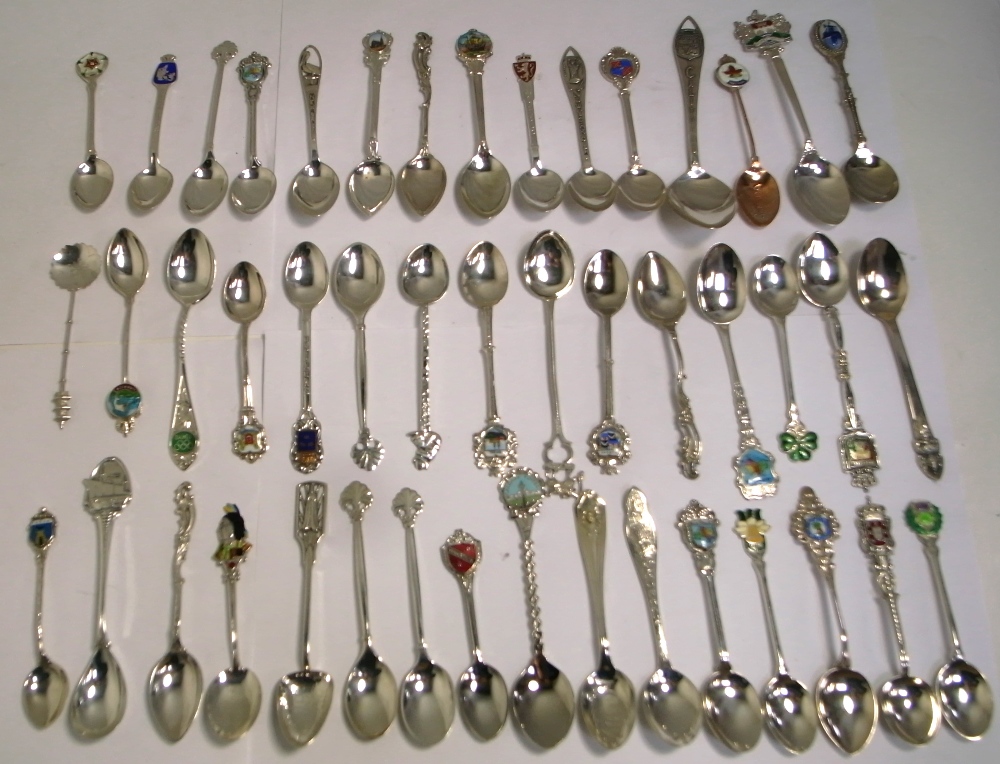 A quantity of hallmarked silver and white metal souvenir spoons, approx combined weight 17ozt.
