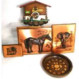 A mid 20th century cuckoo clock, three copper animal wall plaques and a wooden bowl (5).