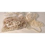 A quantity of half drilled pearls for use in earrings also a quantity of pearl strands.