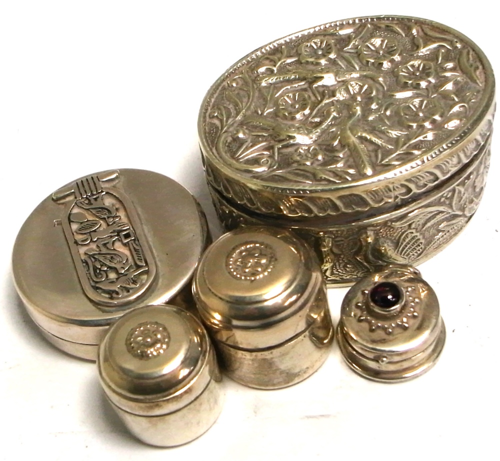 Five various white metal trinket pots with various decoration to include Egyptian hieroglyphics,