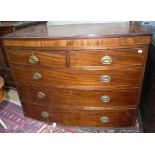 An early 19th century mahogany two over three drawer bow fronted chest of drawers,