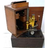 A cased early 20th century Carl Zeiss Jena brass monocular microscope with various Zeiss eye piece