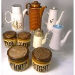 Four brown glazed storage jars by T.G.