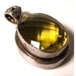 A silver pendant with citrine colour stone, approx weight 1ozt.