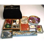 A quantity of costume jewellery to include two Ruskin pottery brooches, lacking pins,