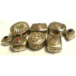 Seven white metal pots, various decoration and a white metal trinket pot marked 925,