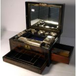 A Victorian coromandel vanity box, the top drawer containing eleven trinket pots and perfume