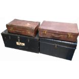 A brass bound wooden travelling trunk of rectangular form bearing the remnants of railway labels,
