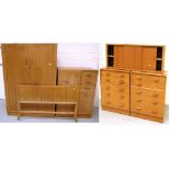 A six piece G Plan bedroom suite comprising two five drawer chest of drawers, double wardrobe,