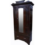 A late 19th early 20th century mahogany wardrobe, shaped top above carved decoration,