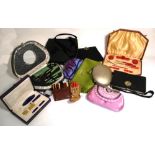 A collection of vintage vanity cases, manicure sets and handbags.