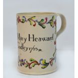 A Yorkshire or Leeds white salt glazed stoneware mug of cylindrical form with strap handle,