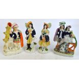 A pair of late 19th century Staffordshire figures of a huntsman and a lady, height 23cm (af), a