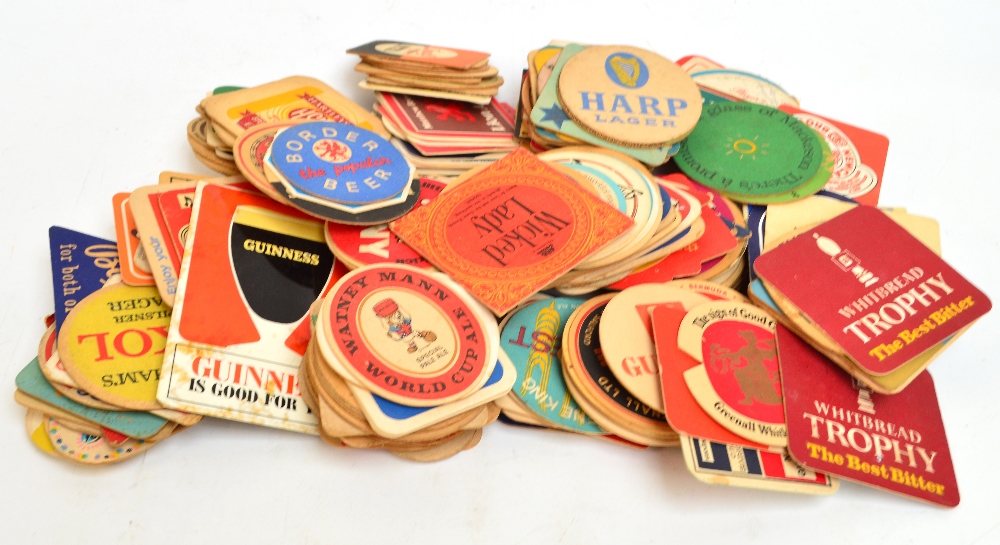 An extensive collection of various cardboard beer mats, approximately 800 mats.