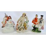 Three late 19th century Staffordshire figure groups, including one depicting a soldier and sailor,