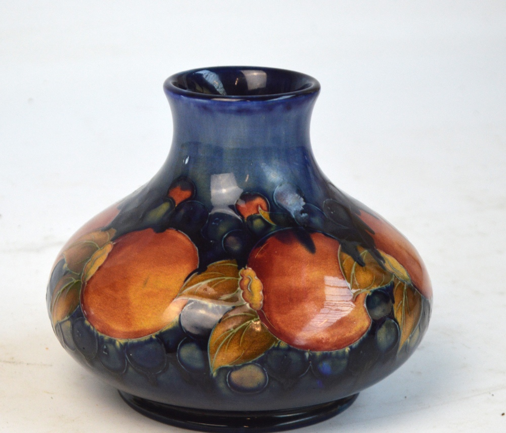 A mid 20th century Moorcroft baluster vase in "Pomegranate" pattern with blue impressed mark to