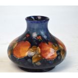 A mid 20th century Moorcroft baluster vase in "Pomegranate" pattern with blue impressed mark to