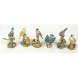Six Royal Worcester matt glazed figures of birds; "Chaffinches", "Yellow Hammers", "Kingfisher",