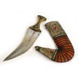 An early 20th century Jambiya dagger with horn handle set with studs and filigree decoration to one