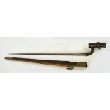 An 1876 pattern Martini-Henry bayonet with Turkish marks and leather scabbard, length 65cm.