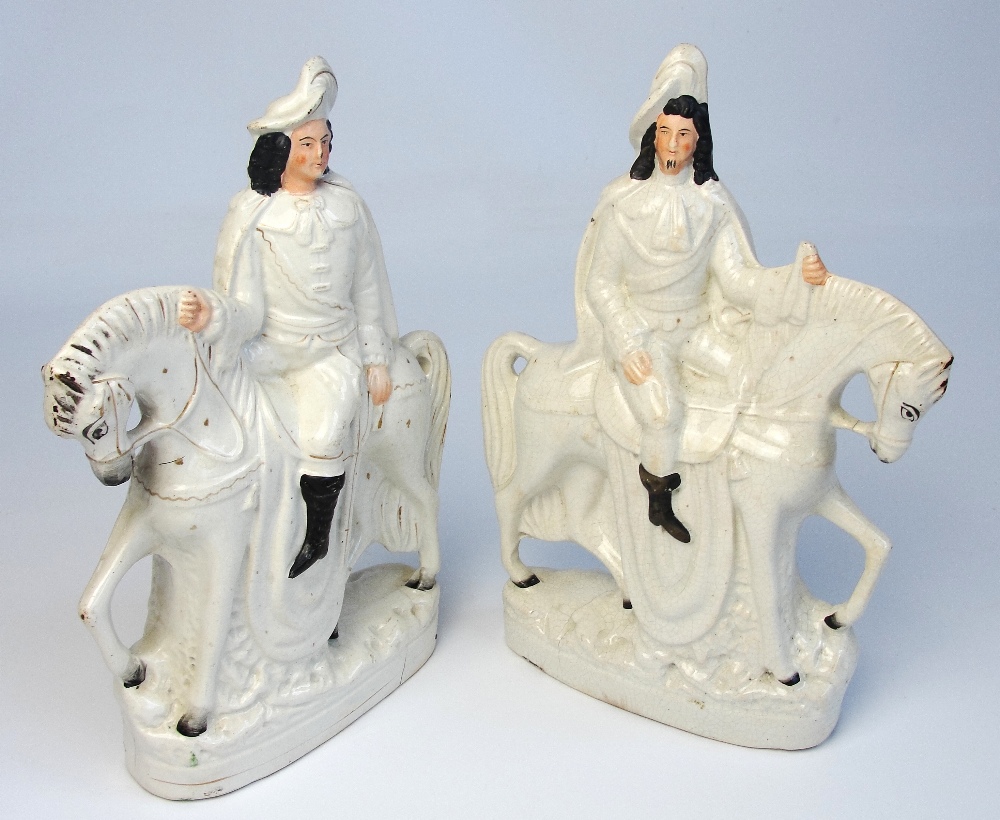 A near pair of late 19th century flatback Staffordshire figures with white glaze, modelled as