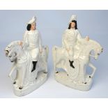 A near pair of late 19th century flatback Staffordshire figures with white glaze, modelled as
