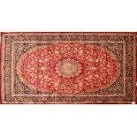 A red ground Keshan carpet, 280 x 200cm.