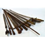 A quantity of decorative swords including examples with wooden handles, horn handles, etc,