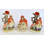 Two late 19th century Staffordshire flatback figural spill vases depicting Red Riding Hood and a