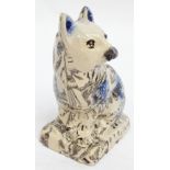 A rare mid 18th century Staffordshire agateware pottery salt glazed figure of a seated cat with