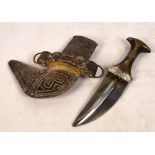 An early 20th century Jambiya with white metal scabbard and mount and horn handle, length 29cm.