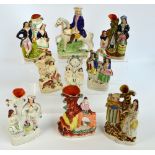 A group of six 19th century Staffordshire figural spill vases and three further flatback figures