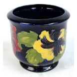 A Moorcroft "Hibiscus" pattern jardinière with tubelined decoration on a blue ground, bearing