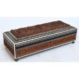 An Anglo-Indian Vizagapatam rectangular glove box set with carved sandalwood panels to each side
