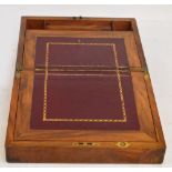 A Victorian walnut and brass bound writing slope of small proportions with compartments to the