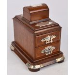 An Edwardian oak and electroplated mounted trinket box with two sectioned pull-out drawers with
