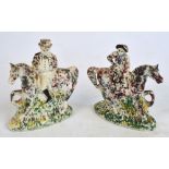 A pair of late 19th century Staffordshire sponge decorated figures of a gentleman and a lady
