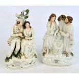 Two late 19th century Staffordshire figural flatback spill vases, both depicting a couple, one