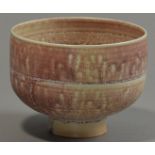 MARY RICH (born 1940); a porcelain footed bowl, mottled pink glaze, impressed M mark, diameter 15cm.