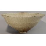 SUTTON TAYLOR (born 1943); an early hand built stoneware bowl, extremely thin walled, undulating