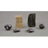 Two Labrodorite stones, two fossilised stones, a polished heart shaped stone and a natural stone