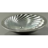ALEX BROGDEN (born 1954); a hallmarked double skinned silver 'Meteor' footed bowl, fluted with