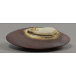 GEOFFREY SWINDELL (born 1945); a miniature porcelain sea shell form, dark rust glaze, incised S