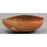 ELSPETH OWEN (born 1938); an oval unglazed earthenware bowl, smoke fired, diameter 21.5cm (max).